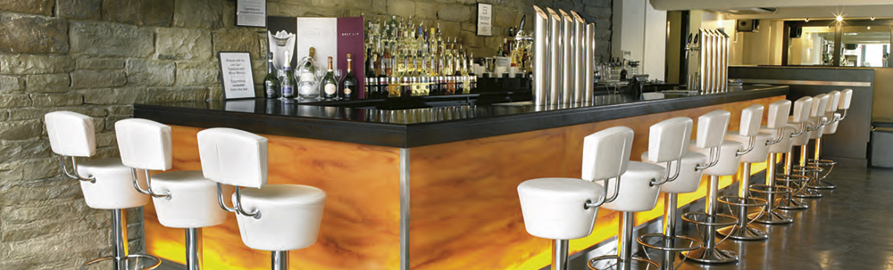 Stylish bar counter with contemporary bar seating in White